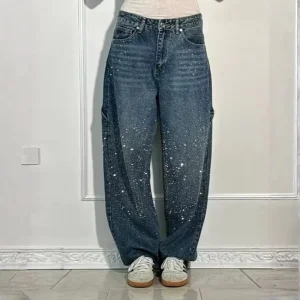 Jean femme taille haute coupe large effet usé